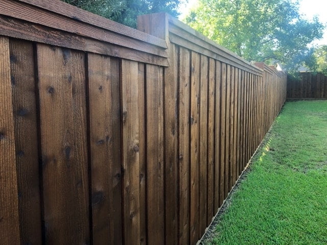 Privacy fence with stain and top cap